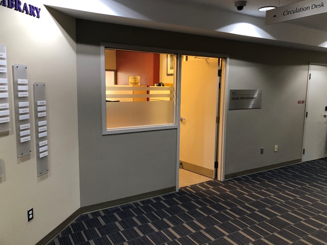 An open doorway to the library administration office.
