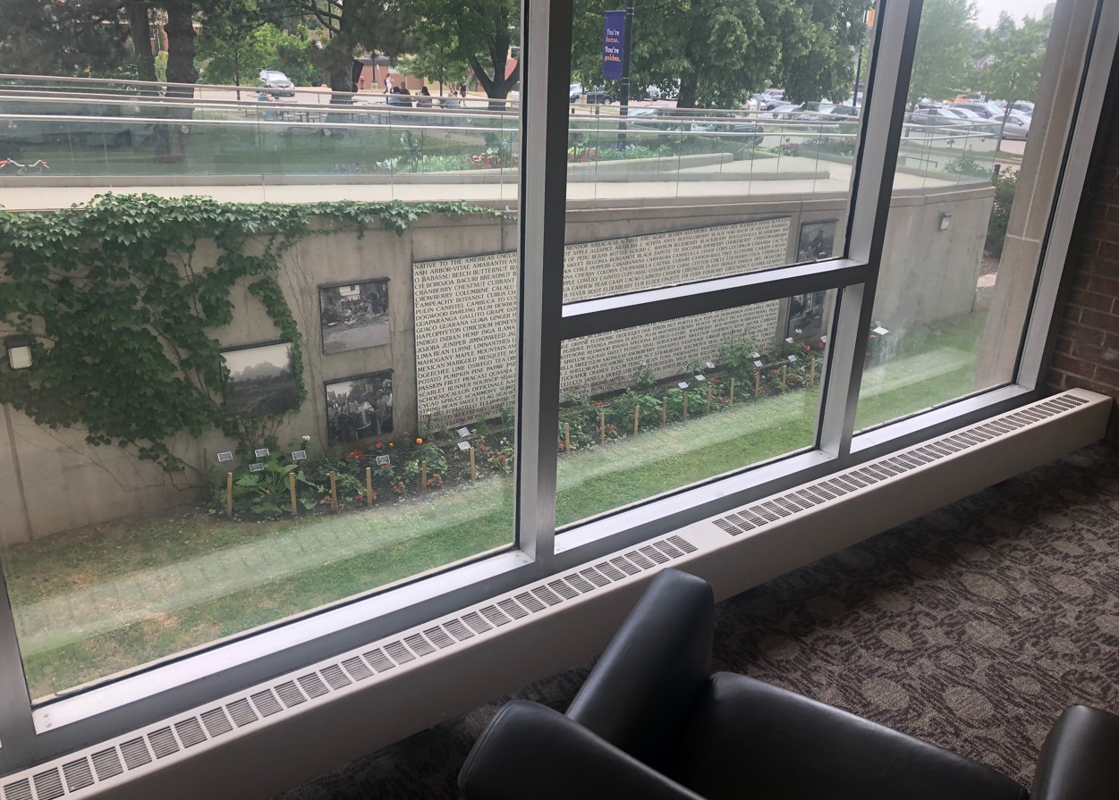 View of garden through window at seating area on main floor