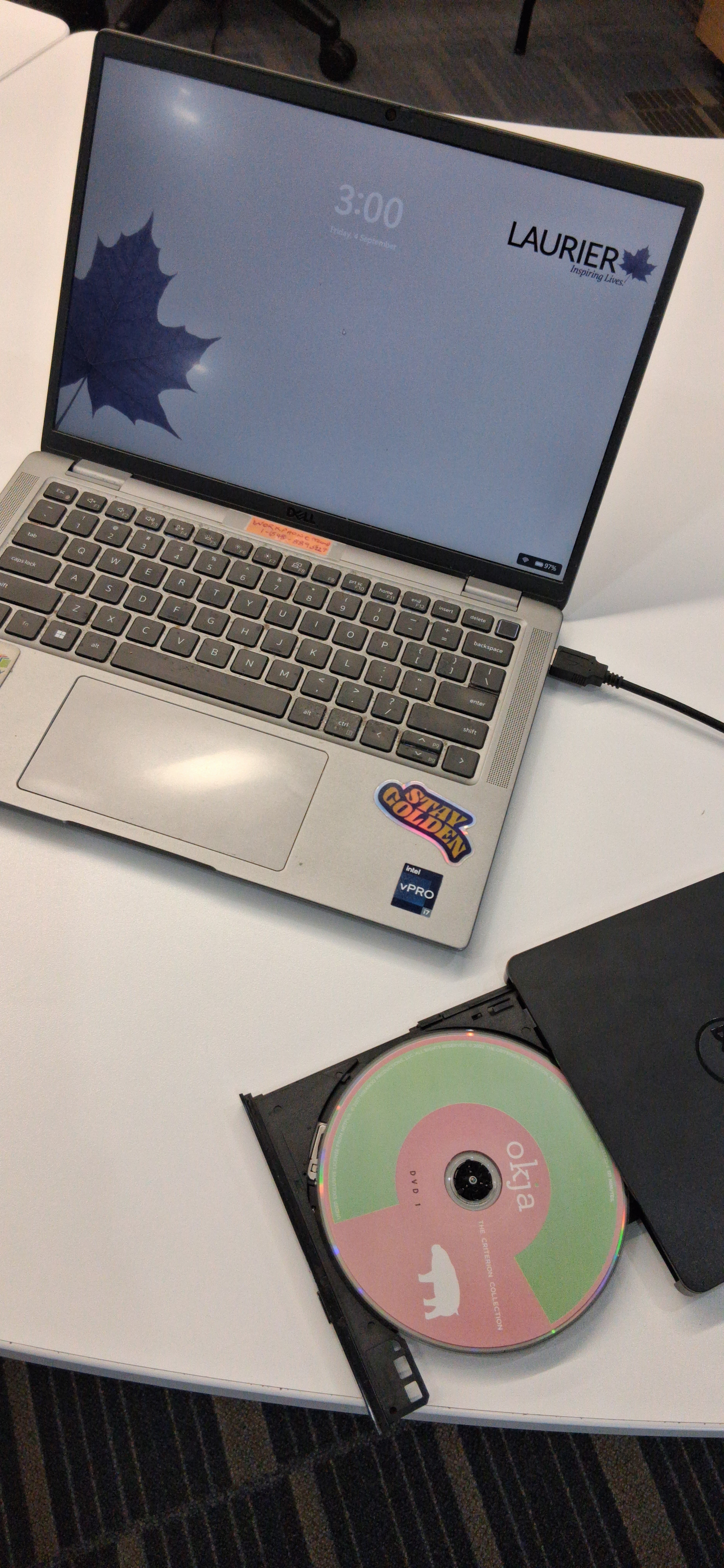 Portable DVD / CD-ROM player plugged into a laptop