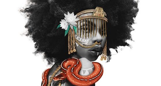 A young black woman with a large afro is looking over her shoulder at the viewer. She wears a gold face veil mask with white flowers, and has two thick gold chains hanging down her back. Twisted around her neck is an orange snake with a black and white stripe. The woman’s back and arms are tattooed with white geometric forms and her fingers display numerous gold rings.